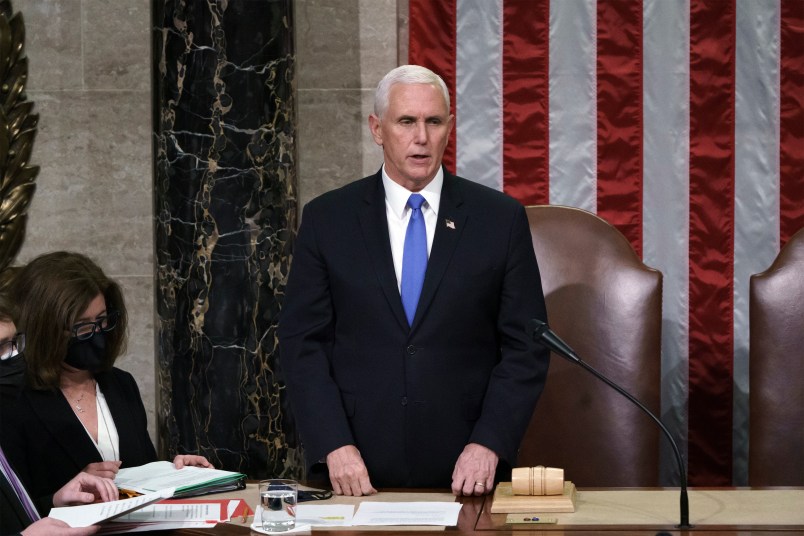 Vice President Mike Pence readS the final certification of Electoral College votes cast in November's presidential election during a joint session of Congress after working through the night, at the Capitol in Washington, Thursday, Jan. 7, 2021. Violent protesters loyal to President Donald Trump stormed the Capitol Wednesday, disrupting the process. (AP Photo/J. Scott Applewhite, Pool)