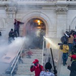 WASHINGTON DC, DISTRICT OF COLUMBIA, UNITED STATES - 2021/01/06: Police use tear gas around Capitol building where pro-Trump supporters riot and breached the Capitol. Rioters broke windows and breached the Capitol building in an attempt to overthrow the results of the 2020 election. Police used batons and tear gas grenades to eventually disperse the crowd. Rioters used metal bars and tear gas as well against the police. (Photo by Lev Radin/Pacific Press/LightRocket via Getty Images)