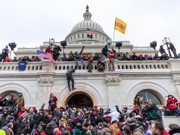 WASHINGTON DC, DISTRICT OF COLUMBIA, UNITED STATES - 2021/01/06: Protesters seen all over Capitol building where pro-Trump supporters riot and breached the Capitol. Rioters broke windows and breached the Capitol building in an attempt to overthrow the results of the 2020 election. Police used batons and tear gas grenades to eventually disperse the crowd. Rioters used metal bars and tear gas as well against the police. (Photo by Lev Radin/Pacific Press/LightRocket via Getty Images)