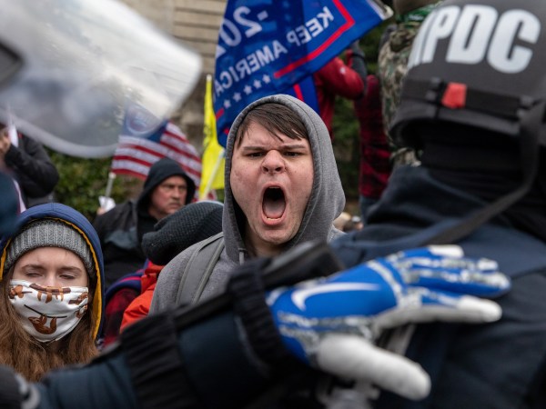 WASHINGTON DC - JANUARY 6: Pro-Trump protestors clash with police during the tally of electoral votes that that would certify Joe Biden as the winner of the U.S. presidential election outside the US Capitol in Washington, DC on Wednesday, January 6, 2021. (Amanda Andrade-Rhoades/For The Washington Post)