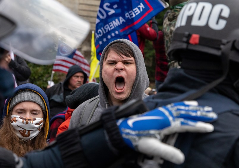 WASHINGTON DC - JANUARY 6: Pro-Trump protestors clash with police during the tally of electoral votes that that would certify Joe Biden as the winner of the U.S. presidential election outside the US Capitol in Washington, DC on Wednesday, January 6, 2021. (Amanda Andrade-Rhoades/For The Washington Post)