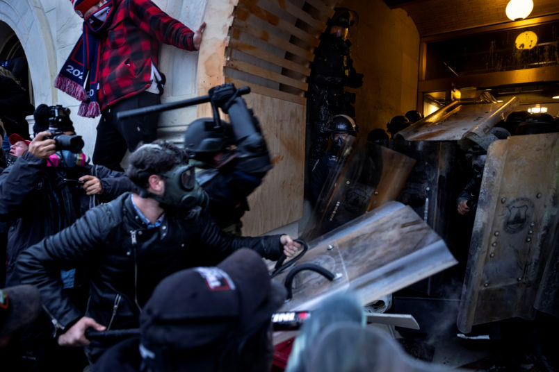 WASHINGTON D.C., USA - JANUARY 6: Trump supporters clash with police and security forces as people try to storm the US Capitol in Washington D.C on January 6, 2021. - Demonstrators breeched security and entered the Capitol as Congress debated the 2020 presidential election Electoral Vote Certification. (photo by Brent Stirton/Getty Images)