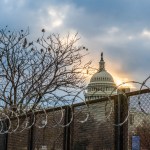 WASHINGTON, DISTRICT OF COLUMBIA, UNITED STATES - 2021/01/23: Razor wire and fences still surround the United States Capitol building at sunrise a few days after the inauguration of President Joe Biden and Vice President Kamala Harris. The Capitol was breached during an insurrection January 6 just days before the inauguration. (Photo by Jeremy Hogan/SOPA Images/LightRocket via Getty Images)