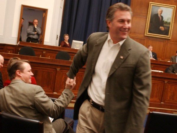 officespace2/112102 --  Member-elect Rick Renzi, R-Ariz., right,is congratulated after he drew number 4 in the freshmen member room selection by member-elect Katherine Harris staffer, Dan Berger, who drew number 1.
