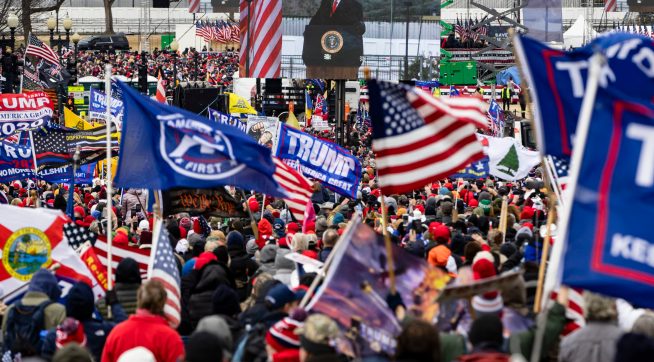WASHINGTON, DC - JANUARY 06: President Donald Trump is seen on a screen as his supporters cheer during a rally on the National Mall on January 6, 2021 in Washington, DC. Trump supporters gathered in the nation's capital today to protest the ratification of President-elect Joe Biden's Electoral College victory over President Trump in the 2020 election. (Photo by Samuel Corum/Getty Images) *** Local Caption *** Donald Trump
