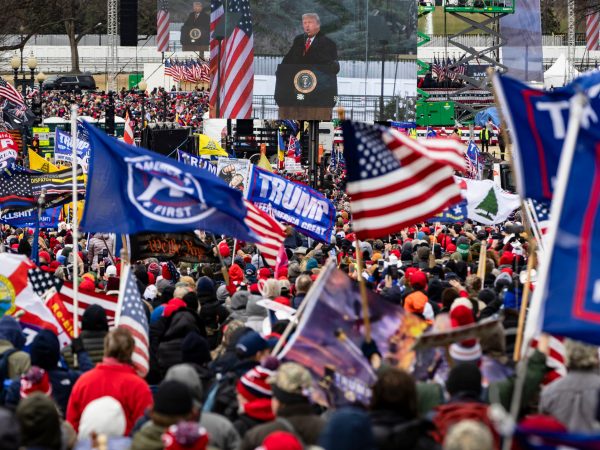 WASHINGTON, DC - JANUARY 06: President Donald Trump is seen on a screen as his supporters cheer during a rally on the National Mall on January 6, 2021 in Washington, DC. Trump supporters gathered in the nation's capital today to protest the ratification of President-elect Joe Biden's Electoral College victory over President Trump in the 2020 election. (Photo by Samuel Corum/Getty Images) *** Local Caption *** Donald Trump