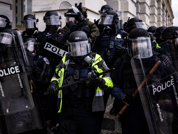 WASHINGTON, DC - JANUARY 06: Police officers attempt to push back pro-Trump supporters that are trying to storm the US Capitol following a rally with President Donald Trump on January 6, 2021 in Washington, DC. Trump supporters gathered in the nation's capital today to protest the ratification of President-elect Joe Biden's Electoral College victory over President Trump in the 2020 election. (Photo by Samuel Corum/Getty Images)