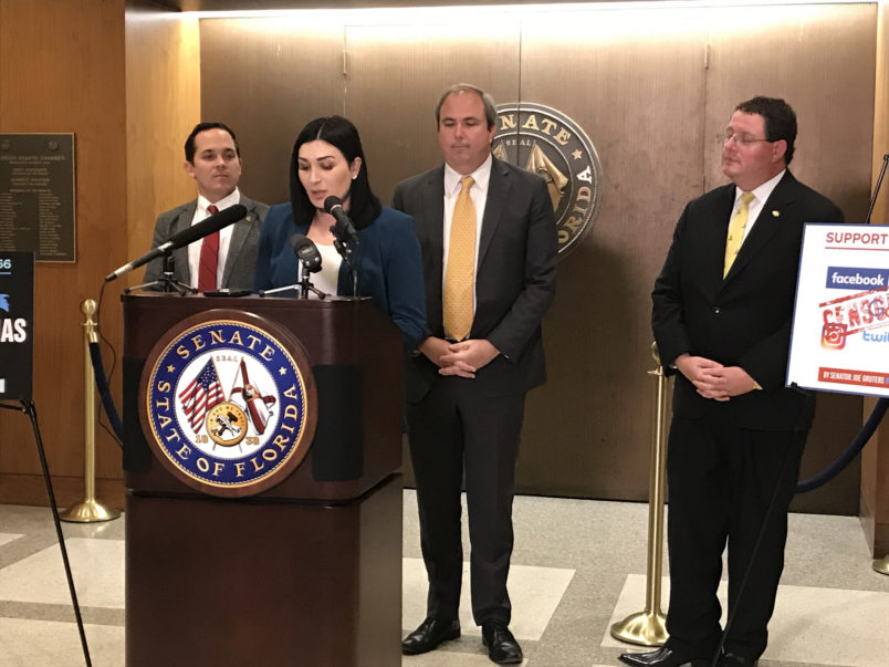 Laura Loomer speaks about a bill that seeks to stop social media censorship, on Tuesday, Jan. 21, 2020, in Tallahassee, Fla. Standing behind Loomer, from left, are state Rep. Anthony Sabatini (R-Fla.), Republican state Sen. Joe Gruters and Republican state Rep. Randy Fine. (Skyler Swisher/Sun Sentinel/TNS)