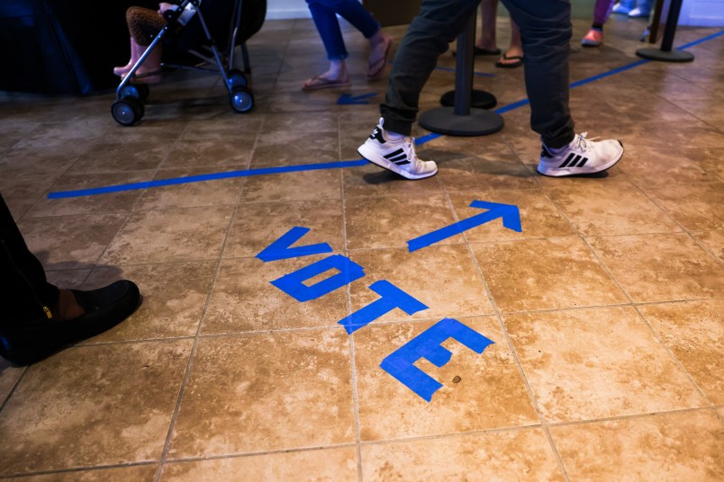 CHARLESTON, SC - OCTOBER 30: People head to the voting booths to cast their in-person absentee ballots at Seacoast Church West Ashley on October 30, 2020 in Charleston, South Carolina. (Photo by Michael Ciaglo/Getty Images)