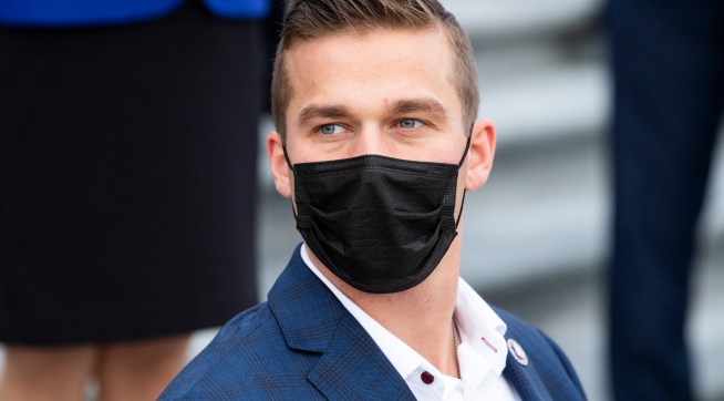 UNITED STATES - JANUARY 4: Rep. Madison Cawthorn, R-N.C., is seen during a group photo with freshmen members of the House Republican Conference on the House steps of the Capitol on Monday, January 4, 2021. (Photo By Tom Williams/CQ Roll Call)