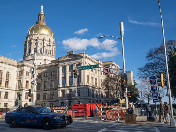 ATLANTA, GA - JANUARY 17: Rifle carrying supporters of the second amendment stand outside of the Georgia Capitol building on January 17, 2021 in Atlanta, United States. Supporters of President Trump gathered at state capitol buildings throughout the nation today to protest the presidential election results and the upcoming inauguration of President-elect Joe Biden.  (Photo by Megan Varner/Getty Images)