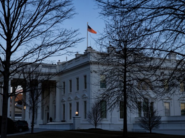 WASHINGTON, DC - MARCH 06: The setting sun illuminates the American flag flying over the White House the evening after the passage of the American Rescue Plan in the U.S. Senate at the White House on March 6, 2021 in Washington, DC. The American Rescue Plan passed in the Senate with a vote of 50-49 and now goes back to the House of Representatives where it is expected that they will vote to approve of the changes made in the Senate. (Photo by Samuel Corum/Getty Images)