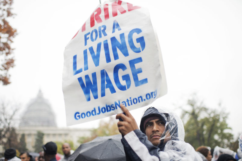 UNITED STATES - NOVEMBER 10: On the day of a Republican presidential debate, striking workers attend a rally in Upper Senate Park with Sen. Bernie Sanders, I-Vt., to call for a minimum wage of $15, November 5, 2015. Many of the low-wage workers hold jobs on Capitol Hill. (Photo By Tom Williams/CQ Roll Call)