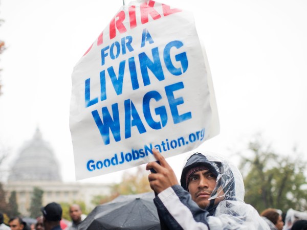 UNITED STATES - NOVEMBER 10: On the day of a Republican presidential debate, striking workers attend a rally in Upper Senate Park with Sen. Bernie Sanders, I-Vt., to call for a minimum wage of $15, November 5, 2015. Many of the low-wage workers hold jobs on Capitol Hill. (Photo By Tom Williams/CQ Roll Call)