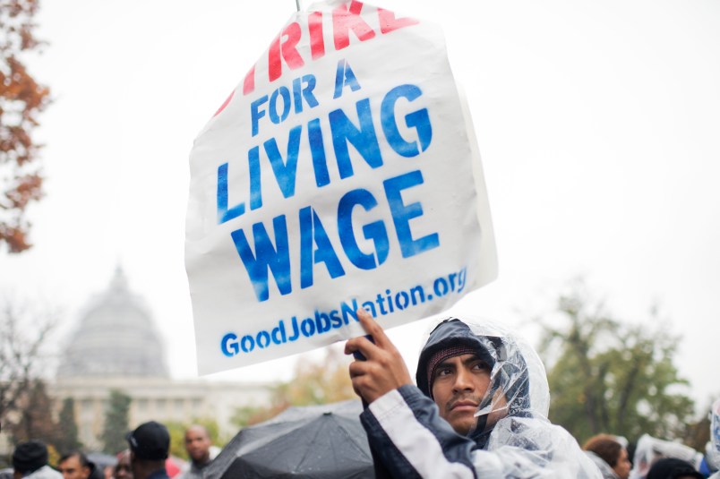 UNITED STATES - NOVEMBER 10: On the day of a Republican presidential debate, striking workers attend a rally in Upper Senate Park with Sen. Bernie Sanders, I-Vt., to call for a minimum wage of $15, November 5, 2015. Many of the low-wage workers hold jobs on Capitol Hill. (Photo By Tom Williams/CQ Roll Call)
