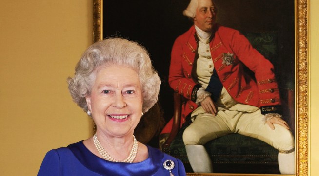 Queen Elizabeth II stands in the 18th Century Room at Buckingham Palace in front of a 1771 portrait by Johann Zoffany of George III, who was king for 59 years (1760-1820).   * This photograph is one of a Golden Jubilee portfolio of photographs being unveiled to mark the 50th anniversary of the Queen's accession. The 18th Century Room is part of the Belgian Suite, used by visiting VIPs at Buckingham Palace - the official London residence of Queen Elizabeth II. 31/05/02 Photographers including the Earl of Lichfield and the rock star Bryan Adams were gathering today to see their Golden Jubilee portraits of the Queen go on public display.Seven photographers were scheduled to attend the National Portrait Gallery n London ahead of a free exhibition to mark the monarch's 50 years on the throne.   (Photo by Fiona Hanson - PA Images/PA Images via Getty Images)