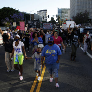 LOS ANGELES, CA - MAY 27: People take to the streets during a Black Lives Matter protest in downtown  on Wednesday, May 27, 2020 in Los Angeles, CA. Several hundred protesters, many in masks, converged on downtown as part of a series of national outrage over the death of George Floyd. (Dania Maxwell / Los Angeles Times)