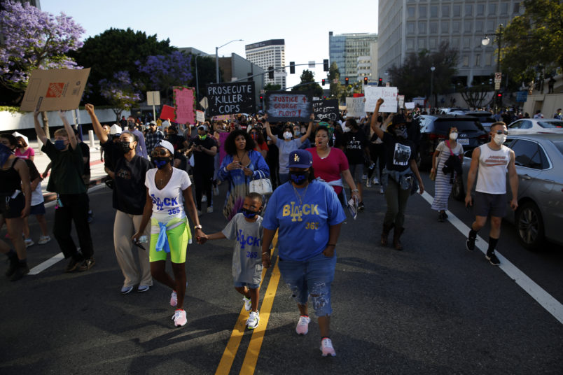 LOS ANGELES, CA - MAY 27: People take to the streets during a Black Lives Matter protest in downtown  on Wednesday, May 27, 2020 in Los Angeles, CA. Several hundred protesters, many in masks, converged on downtown as part of a series of national outrage over the death of George Floyd. (Dania Maxwell / Los Angeles Times)