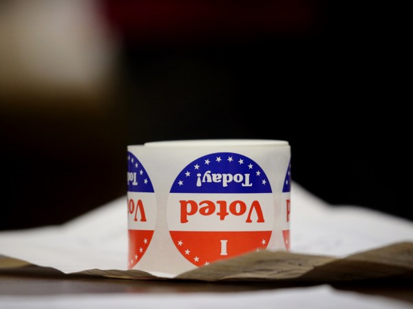 QUINCY - NOVEMBER 3: Stickers sit on a table at Saint John the Baptist Parish in Quincy, MA on election day, November 03, 2020. Massachusetts voters headed to the polls amid a pandemic and political maelstrom. (Photo by Craig F. Walker/The Boston Globe via Getty Images)