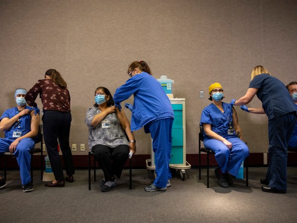 PORTLAND, OR - DECEMBER 16 : Healthcare workers get the Pfizer-BioNTech COVID-19 vaccination at the Legacy Emanuel Medical Center on December 16, 2020 in Portland, Oregon. Today was the first day of vaccinations in Oregon. (Photo by Paula Bronstein/Getty Images)