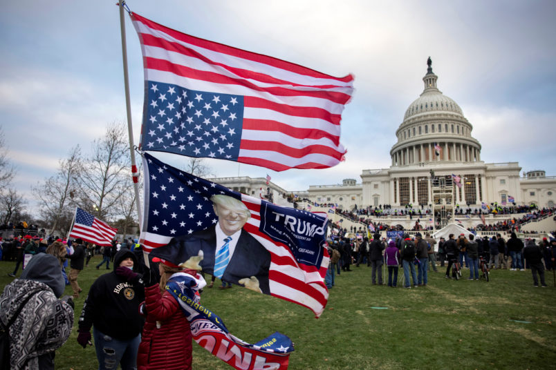 nation's capital to protest the ratification of President-elect Joe Biden's Electoral College victory over President Trump in the 2020 election. A pro-Trump mob later stormed the Capitol, breaking windows and clashing with police officers. Five people died as a result.  (Photo by Brent Stirton/Getty Images)