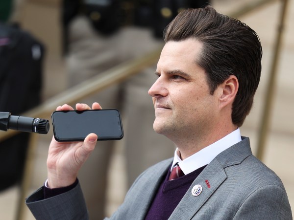 CHEYENNE, WY - JANUARY 28: Rep. Matt Gaetz (R-FL) holds a phone to the microphone as Donald Trump Jr. speaks remotely to a crowd during a rally against Rep. Liz Cheney (R-WY) on January 28, 2021 in Cheyenne, Wyoming. Gaetz and Trump Jr. added their voices to a growing effort to vote Cheney out of office after she voted in favor of impeaching Donald Trump. (Photo by Michael Ciaglo/Getty Images)