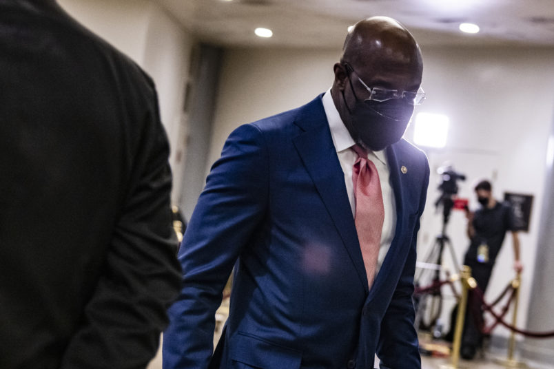 WASHINGTON, DC - FEBRUARY 13: Senator Raphael Warnock (D-GA) walks through the Senate subway before the start of the fourth day in the Senates second impeachment trial of former President Donald Trump on February 13, 2021 in Washington, DC. The Senate voted 55-45 in favor of calling witnesses in the trial to decide on if Trump should or should not be held responsible for the January 6th attack at the U.S. Capitol. (Photo by Samuel Corum/Getty Images) *** Local Caption *** Raphael Warnock