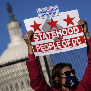 WASHINGTON, DC - MARCH 22: Residents of the District of Columbia rally for statehood near the U.S. Capitol on March 22, 2021 in Washington, DC. On Monday, the House Oversight Committee is holding a hearing on legislation that the House passed last summer that would establish the District of Columbia as the 51st state. The District has a population of nearly 700,000 residents. (Photo by Drew Angerer/Getty Images)