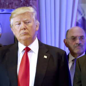 Donald Trump arrives for a press conference at Trump Tower in New York, as Allen Weisselberg, chief financial officer of The Trump Organization, looks on January 11, 2017. (zTIMOTHY A. CLARY/AFP via Getty Images)
