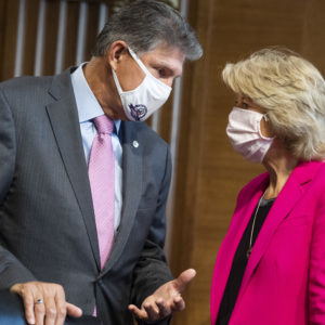 UNITED STATES - SEPTEMBER 16: Chairman Lisa Murkowski, R-Alaska, and ranking member Sen. Joe Manchin, D-W. Va., arrive for the Senate Energy and Natural Resources Committee confirmation hearing in Dirksen Building for Mark C. Christie and Allison Clements, nominees to be members of the Federal Energy Regulatory Commission, on Wednesday, September 16, 2020. (Photo By Tom Williams/CQ Roll Call)