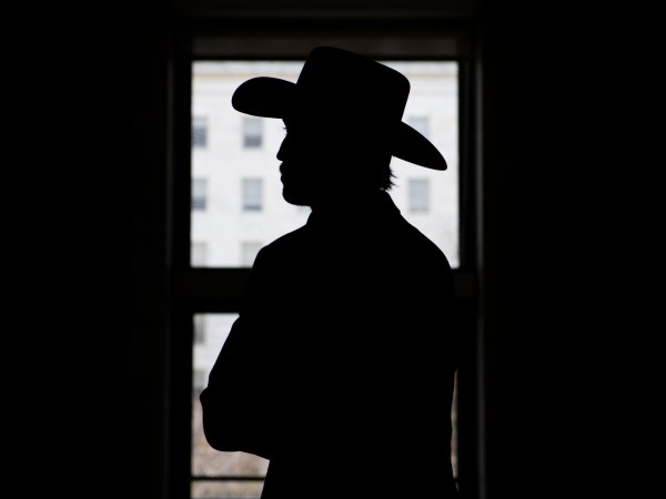 UNITED STATES - NOVEMBER 18: A man wearing cowboy hat is seen at the horseshoe entrance of Rayburn Building on Wednesday, November 18, 2020. (Photo By Tom Williams/CQ Roll Call)