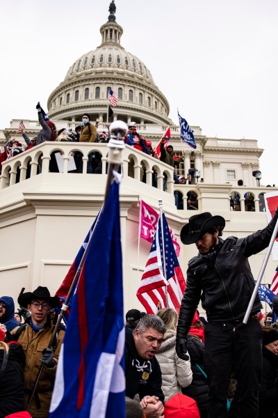 WASHINGTON, DC - JANUARY 06: Pro-Trump supporters storm the US Capitol following a rally with President Donald Trump on January 6, 2021 in Washington, DC. Trump supporters gathered in the nation's capital today to protest the ratification of President-elect Joe Biden's Electoral College victory over President Trump in the 2020 election. (Photo by Samuel Corum/Getty Images)