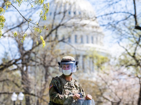 UNITED STATES - APRIL 2: U.S. National Guardsmen stand guard near Constitution Avenue NW after a man was shot during a confrontation with Capitol Police at the north barricade entrance to the Capitol on Friday, April 2, 2021. (Photo By Tom Williams/CQ Roll Call)
