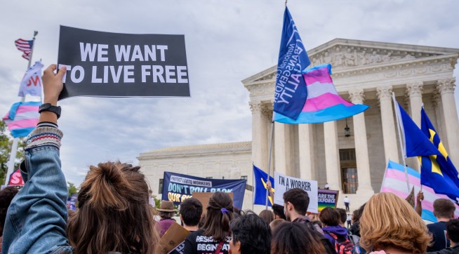 WASHINGTON DC, UNITED STATES - 2019/10/08: Participant holding a sign outsithe the Supreme Court. 133 protesters were arrested blocking the street across the Supreme Court in an act of non violent civil disobedience, as hundreds of LGBTQ+ advocates convened in Washington, DC for a national day of action as a community response to the landmark Supreme Court hearings that could legalize workplace discrimination, primarily against LGBTQ+ people, on the basis of sexual orientation, gender identity, and gender presentation. (Photo by Erik McGregor/LightRocket via Getty Images)