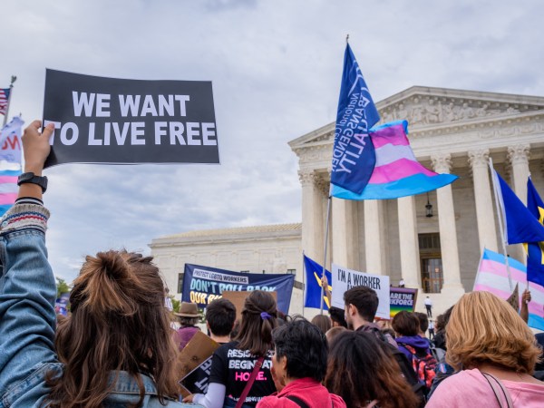 WASHINGTON DC, UNITED STATES - 2019/10/08: Participant holding a sign outsithe the Supreme Court. 133 protesters were arrested blocking the street across the Supreme Court in an act of non violent civil disobedience, as hundreds of LGBTQ+ advocates convened in Washington, DC for a national day of action as a community response to the landmark Supreme Court hearings that could legalize workplace discrimination, primarily against LGBTQ+ people, on the basis of sexual orientation, gender identity, and gender presentation. (Photo by Erik McGregor/LightRocket via Getty Images)