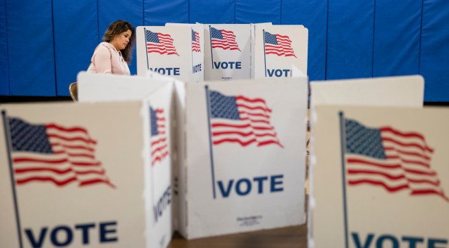 ARLINGTON, VA - MARCH 03: A woman marks down her vote on a ballot for the Democratic presidential primary election at a polling place in Armstrong Elementary School on Super Tuesday, March 3, 2020 in Arlington, Virginia. 1,357 Democratic delegates are at stake as voters cast their ballots in 14 states and American Somoa on what is known as Super Tuesday. (Photo by Samuel Corum/Getty Images)
