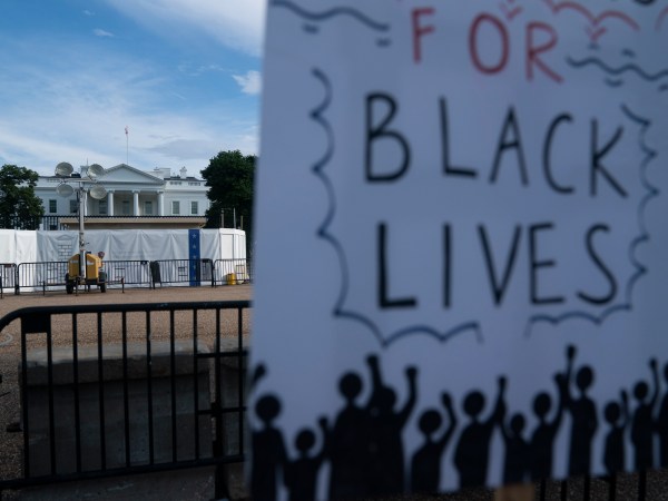 WASHINGTON D.C., June 20, 2020 -- A sign is seen during protests against racial injustice to mark Juneteenth, commemorating the end of slavery in the United States, near the White House in Washington, D.C., the United States, June 19, 2020. This year's Juneteenth comes amid nationwide demonstrations against police brutality and racism triggered by the death of George Floyd in police custody. More than 20 rallies, marches and events were scheduled for Friday in Washington, D.C., with hundreds more in over 40 states, according to the Movement for Black Lives, a coalition of U.S. groups representing the interests of black communities. (Photo by Liu Jie/Xinhua via Getty)