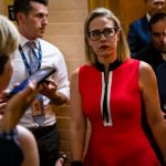 WASHINGTON, DC - JUNE 08: U.S. Sen. Kirsten Sinema (D-AZ) heads back to a bipartisan meeting on infrastructure in the basement of the U.S. Capitol building after the original talks fell through with the White House on June 8, 2021 in Washington, DC. Senate Majority Leader Chuck Schumer (D-NY) said they are now pursuing a two-path proposal that includes a new set of negotiations with a bipartisan group of senators. (Photo by Samuel Corum/Getty Images) *** Local Caption *** Kirsten Sinema