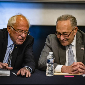 WASHINGTON, DC - JUNE 16: (R-L) U.S. Senate Majority Leader Chuck Schumer (D-NY) and Committee Chairman Bernie Sanders (D-VT) holding a meeting with Senate Budget Committee Democrats in the Mansfield Room at the U.S. Capitol building on June 16, 2021 in Washington, DC. The Majority Leader and Democrats on the Senate Budget Committee are meeting to discus how to move forward with the Biden Administrations budget proposal. (Photo by Samuel Corum/Getty Images) *** Local Caption *** Chuck Schumer; Bernie Sanders