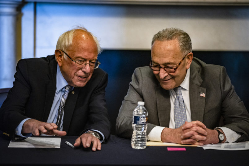 WASHINGTON, DC - JUNE 16: (R-L) U.S. Senate Majority Leader Chuck Schumer (D-NY) and Committee Chairman Bernie Sanders (D-VT) holding a meeting with Senate Budget Committee Democrats in the Mansfield Room at the U.S. Capitol building on June 16, 2021 in Washington, DC. The Majority Leader and Democrats on the Senate Budget Committee are meeting to discus how to move forward with the Biden Administrations budget proposal. (Photo by Samuel Corum/Getty Images) *** Local Caption *** Chuck Schumer; Bernie Sanders