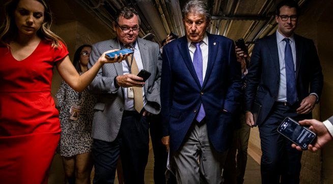 WASHINGTON, DC - JULY 26: U.S. Sen. Joe Manchin (D-WV) is followed by a swarm of reporters as he leaves a meeting between a group of bipartisan Senators in the basement of the U.S. Capitol Building on July 26, 2021 in Washington, DC. The group of Senators are trying to come to an agreement on the Infrastructure Bill before Congress heads into their August recess after the initial agreement fell apart. (Photo by Samuel Corum/Getty Images) *** Local Caption *** Joe Manchin