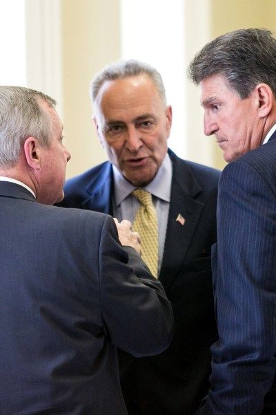 WASHINGTON, DC - JULY 9: (L-R) Sen. Angus King (I-ME), Sen. Dick Durbin (D-IL), Sen. Chuck Schumer (D-NY), Sen. Tom Carper (D-DE) and Sen. Joe Manchin (D-WV) speak with each other after a closed-door meeting with fellow Democratic Senators, on Capitol Hill, July 9, 2013 in Washington, DC. The senators fielded questions from the media on student loan legislation. (Photo by Drew Angerer/Getty Images)
