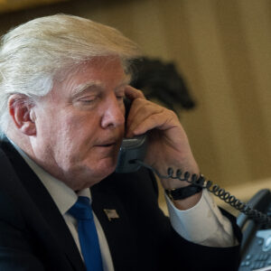 WASHINGTON, DC - JANUARY 28: President Donald Trump speaks on the phone with Russian President Vladimir Putin in the Oval Office of the White House, January 28, 2017 in Washington, DC. On Saturday, President Trump is making several phone calls with world leaders from Japan, Germany, Russia, France and Australia. (Photo by Drew Angerer/Getty Images)