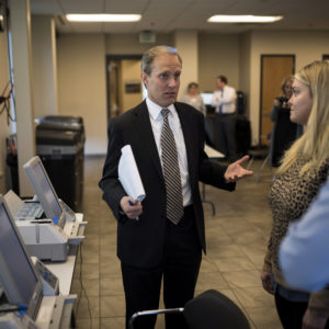 MINNEAPOLIS, MN - OCTOBER 23: Minnesota Secretary of State Steve Simon (L) speaks with city clerk Melissa Kennedy (C) and election specialist Robert Stokka (R) during a public accuracy testing of Election Day voting machines at the Municipal Services Center on October 23, 2018 in St. Louis Park, Minnesota. Each jurisdiction that operates electronic voting equipment must hold a public accuracy test within 14 days of the election (Photo by Stephen Maturen/Getty Images)