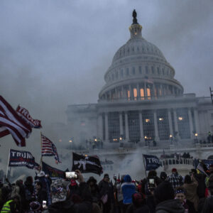 WASHINGTON, DISTRICT OF COLUMBIA, UNITED STATES - 2021/01/06: Security forces respond with tear gas after the US President Donald Trump's supporters breached the US Capitol security. Pro-Trump rioters stormed the US Capitol as lawmakers were set to sign off Wednesday on President-elect Joe Biden's electoral victory in what was supposed to be a routine process headed to Inauguration Day. (Photo by Probal Rashid/LightRocket via Getty Images)