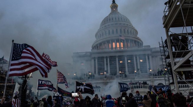 WASHINGTON, DISTRICT OF COLUMBIA, UNITED STATES - 2021/01/06: Security forces respond with tear gas after the US President Donald Trump's supporters breached the US Capitol security. Pro-Trump rioters stormed the US Capitol as lawmakers were set to sign off Wednesday on President-elect Joe Biden's electoral victory in what was supposed to be a routine process headed to Inauguration Day. (Photo by Probal Rashid/LightRocket via Getty Images)