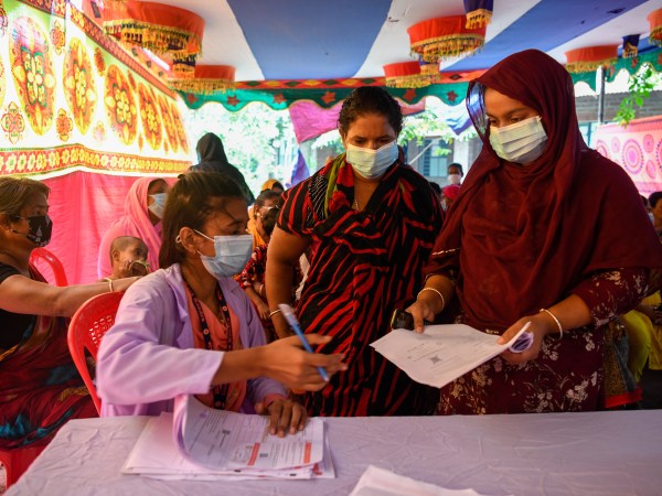 DHAKA, BANGLADESH - 2021/08/18: A health worker seen registering sex workers against the Covid-19 coronavirus at special vaccination drive held in Daulatdia outskirt of Dhaka. (Photo by Piyas Biswas/SOPA Images/LightRocket via Getty Images)