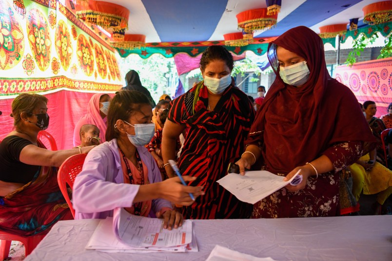 DHAKA, BANGLADESH - 2021/08/18: A health worker seen registering sex workers against the Covid-19 coronavirus at special vaccination drive held in Daulatdia outskirt of Dhaka. (Photo by Piyas Biswas/SOPA Images/LightRocket via Getty Images)