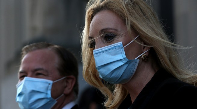Mark and Patricia McCloskey leave the Carnahan Couthouse on Wednesday, Oct. 14, 2020, after pleading not guilty to two felony charges each of unlawful use of a weapon and evidence tampering for an incident in June when they pointed guns at protesters in front of their Portland Place home. (Laurie Skrivan/St. Louis Post-Dispatch/TNS)