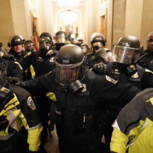WASHINGTON, DC - JANUARY 06:  Riot police clear the hallway inside the Capitol on Wednesday, Jan. 6, 2021 in Washington, DC. (Kent Nishimura / Los Angeles Times)